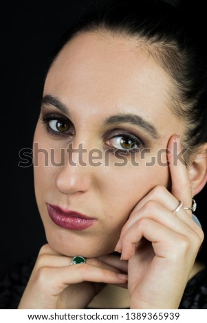 Close up portrait of a pretty brunette with dark lipstick