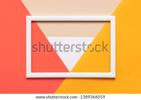 Abstract geometrical , yellow and white paper flat lay background. Minimalism, geometry and symmetry template with empty picture frame mock up.