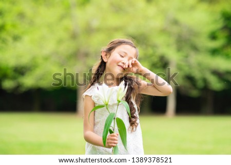 Cute girl with white lily