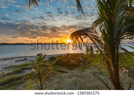 Sunrise dramatic sky on sea, tropical desert beach, no people, stormy clouds, travel destination, Indonesia Banyak Islands Sumatra