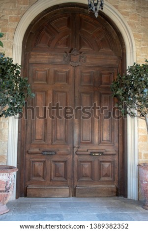 Large ornate wooden door, grand entrance.