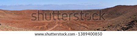 panorama picture of the red moutain, montana roja, crater landscape near Playa Blanca, Lanzarote
