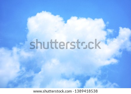 Blue sky and heart shaped clouds