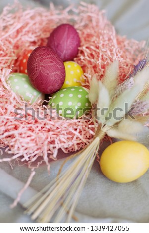 Colourful easter eggs in basket
