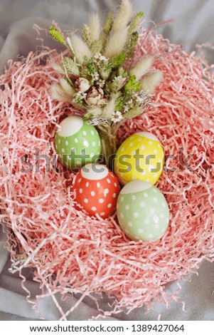Colourful easter eggs in basket