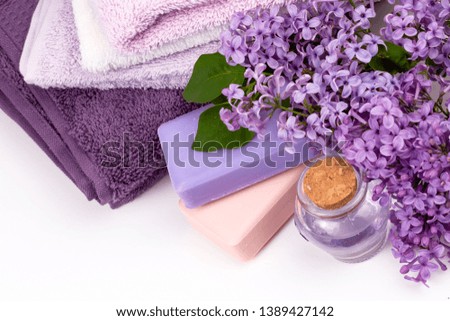 Lilac flower and soap, spa concept photo. 