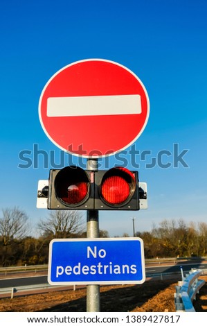 No entry and no pedestrians at the off-slip of a UK motorway