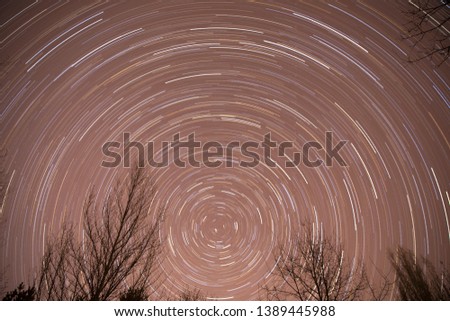 Astronomy photography star trail in northern night sky 