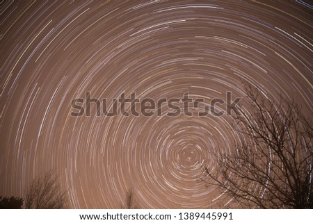Astronomy photography star trail in northern night sky 