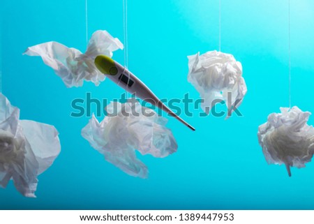 Electronic thermometer on blue background. Cold and flu concepts. Healthcare, medicine, flu and treatment concept