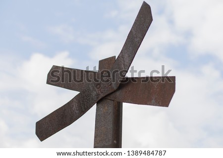 close up of old rusty railroad crossing sign