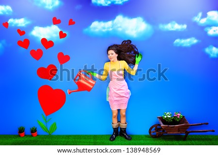 Romantic young woman is growing her love like a flower.