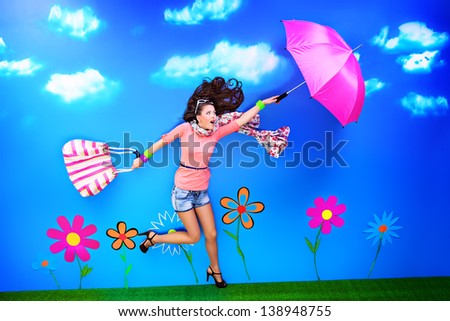 Romantic girl is running through the fabulous field of flowers.