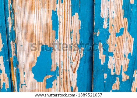 Background of weathered woode with chipping blue paint