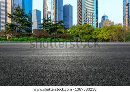 Shanghai modern commercial office buildings and empty asphalt road 
