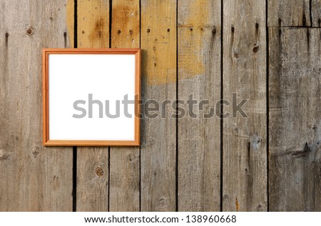 Frame for photos on weathered wooden wall