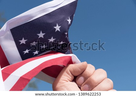 A man and the flag of United States of America