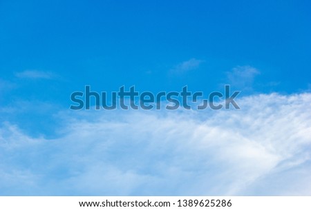 Fluffy cloud over tropical blue sky