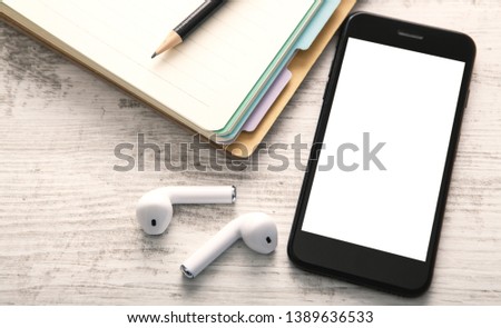 notebook, smartphone and wireless headphones; view from above