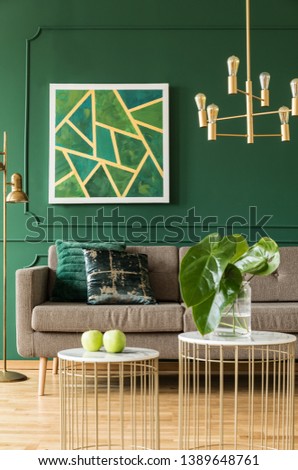 Gold details in green living room interior