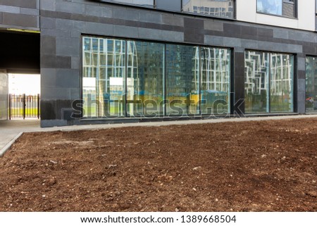 Panoramic window of modern residential building view outside. Insulating glass (glazing, pane). Storm windows. Ground floor apartment. first for shops, offices and commercial premises. Rainscreen
