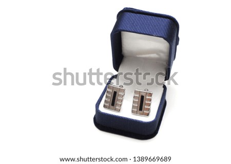Classic blue box with man's cufflinks on white background