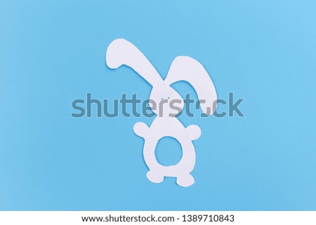 paper rabbit on the blue background image