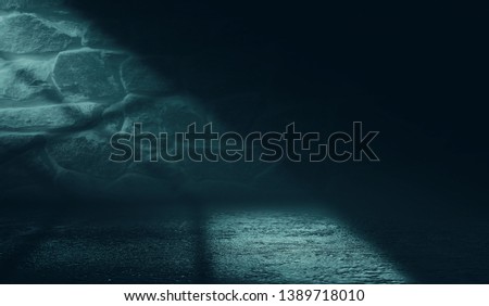 Empty scene background. Incident light from a window on an empty brick wall. Dark abstract background
