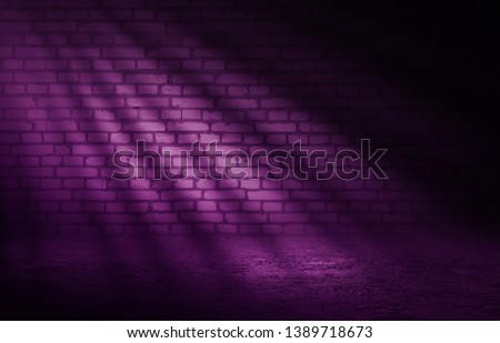 Empty scene background. Incident light from a window on an empty brick wall. Dark abstract background