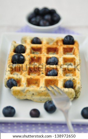 Poppy Seed Waffles with ice cream and blueberries