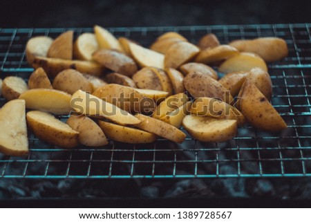 Fried potatoes on the grill