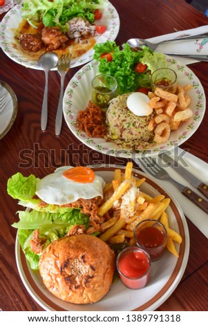 American Breakfast set with pork  Served with fried eggs and french fries  And Thai food set  A wonderful breakfast