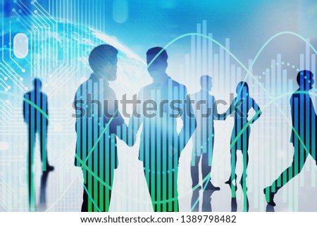 Silhouettes of business people shaking hands and communicating over Earth background with circuits and graphs. Concept of hi tech. Toned image double exposure. Elements of this image furnished by NASA