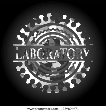 Laboratory written on a grey camouflage texture