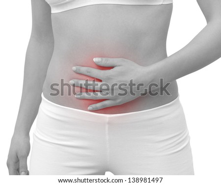 Acute pain in a woman belly. Female holding hand to spot of belly-ache. Concept photo with Color Enhanced blue skin with read spot indicating location of the pain. Isolation on a white background. 