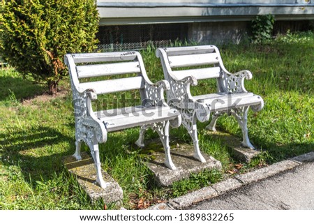 Small white benches, selective focus