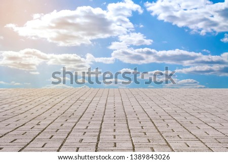 stone pavement tiles and sky with clouds