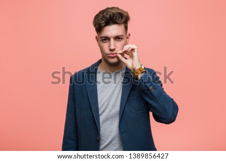 Young business natural man with fingers on lips keeping a secret.