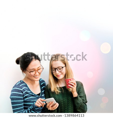 Young women looking at a phone