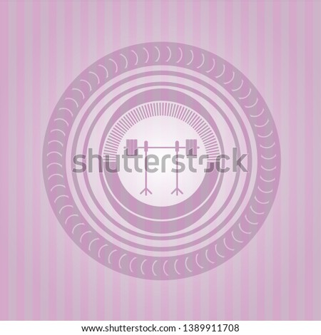 barbell on rack icon inside pink emblem