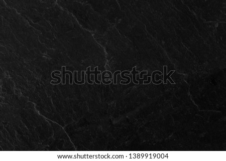 Dark grey black slate background, black stone surfaces.
