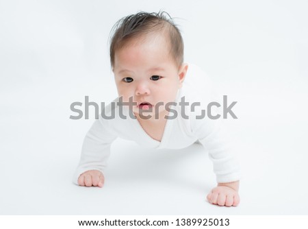 6 Months old baby on white background