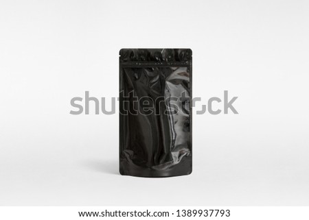 big black resealable coffee pouch in plastic Royalty-Free Stock Photo #1389937793