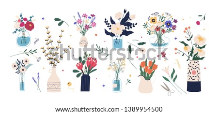 Collection of wild and garden blooming flowers in vases and bottles isolated on white background. Bundle of bouquets. Set of decorative floral design elements. Flat cartoon vector illustration. Royalty-Free Stock Photo #1389954500