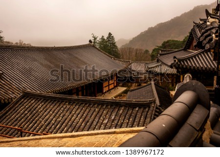 tample roofs ageinst the backdrop of the mountain, Busan, South Korea