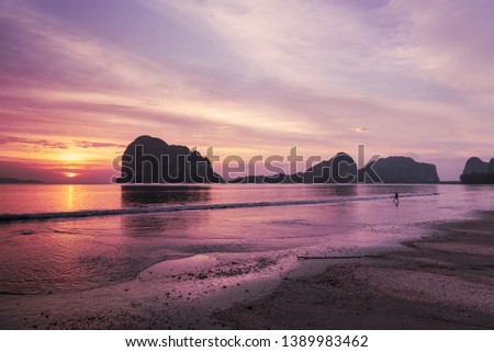 Beautiful Sunset over Pagmeng Beach with 
Limestone Mounthern, South of Thailand, Trang, Vacation inThailand 