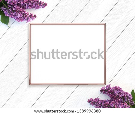 Rose gold frame mockup with with purple lilac blossoms. 4x5 ratio landscape.