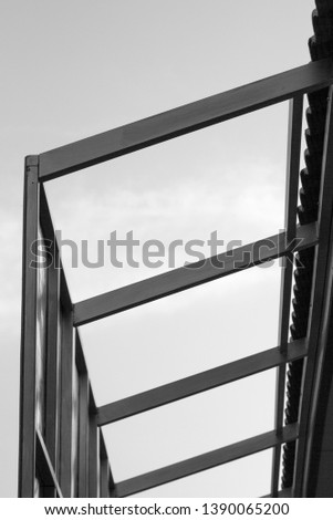 Structure of steel roof frame for building construction.Black and white photo.