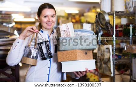 Girl is demonstraiting modern home decoration in furniture shop