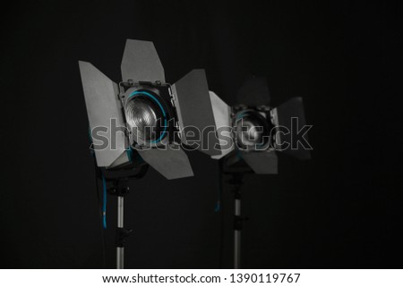 Lighting Equipment used on film sets, in television and photo studios, in theaters as well as at major trade fairs and events. Photo on black backdrop